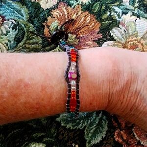 Hand crafted. Leather and seed bead bracelet with button clasp